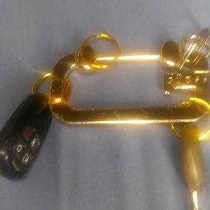 Designer Guess,  ( gold color ) key